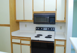 Step Two: Doors Removed: The cabinet doors are removed and discarded 